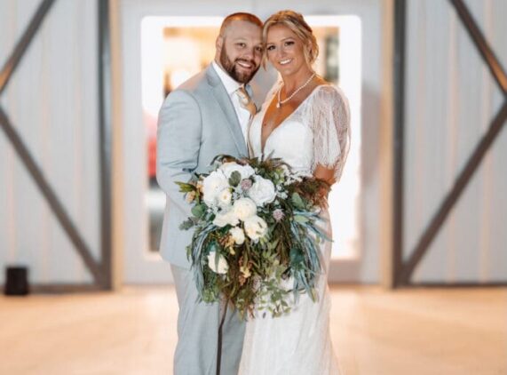 Bride and groom portrait outside of a wedding barn venue